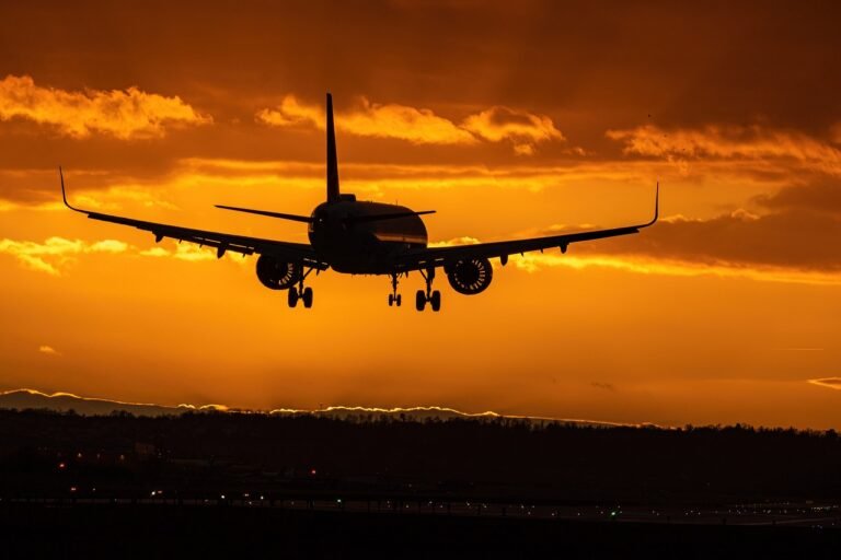 Aircraft landing at sunset: private airport transfers from Hewanorra International Airport (UVF), Saint Lucia