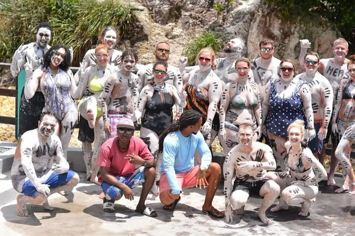 Guests covered in volcanic mud at the Sulphur Springs mud bath in Soufrière, Saint Lucia